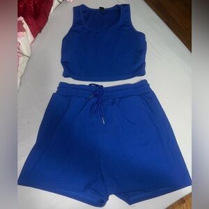 Blue tank and track shorts